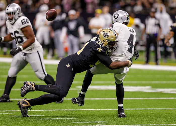 New Orleans Saints defensive end Cameron Jordan tackles Las Vegas Raiders quarterback Derek Carr as the ball flies out of the quarterback’s hands